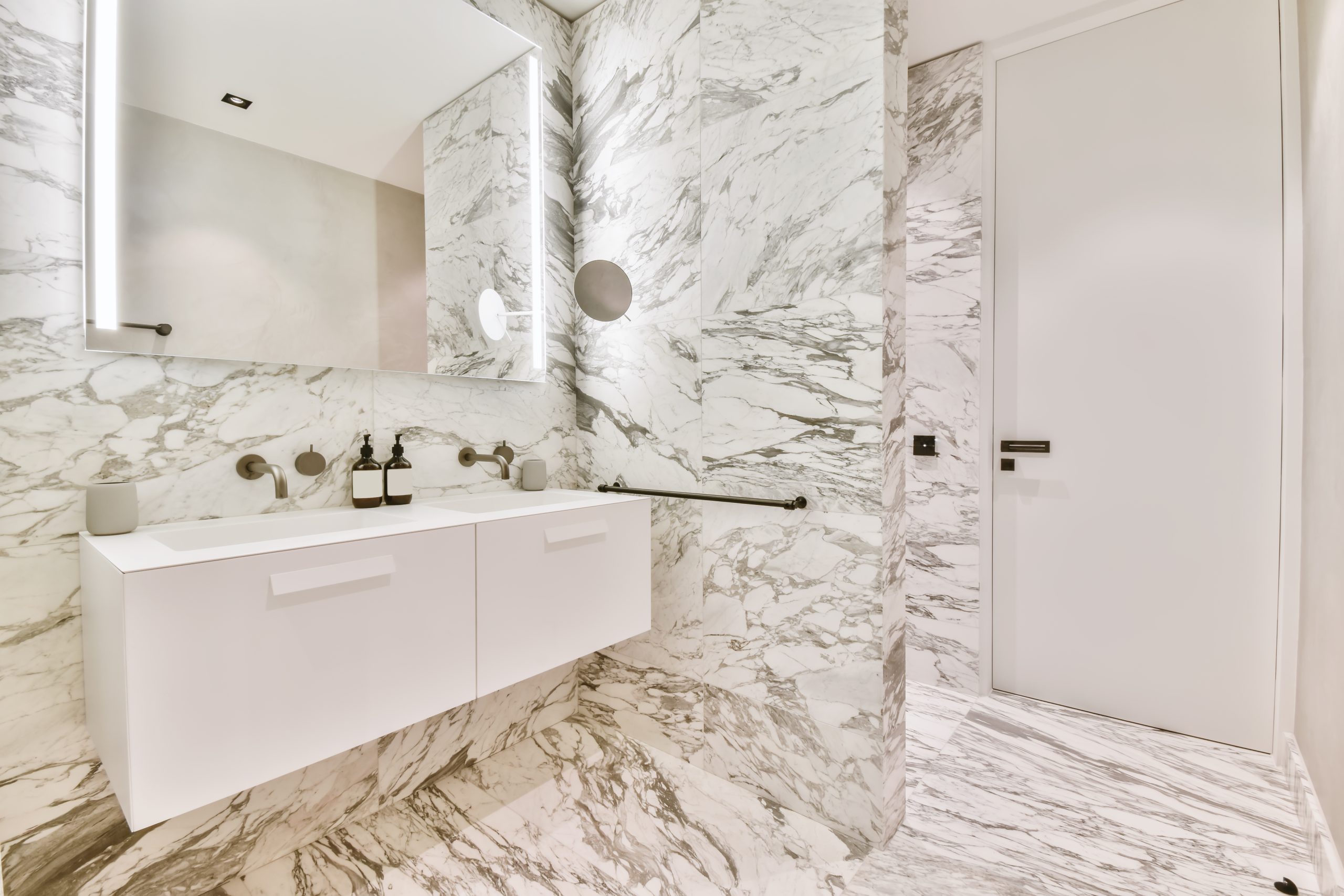 Attractive bathroom with a large square mirror and two sinks