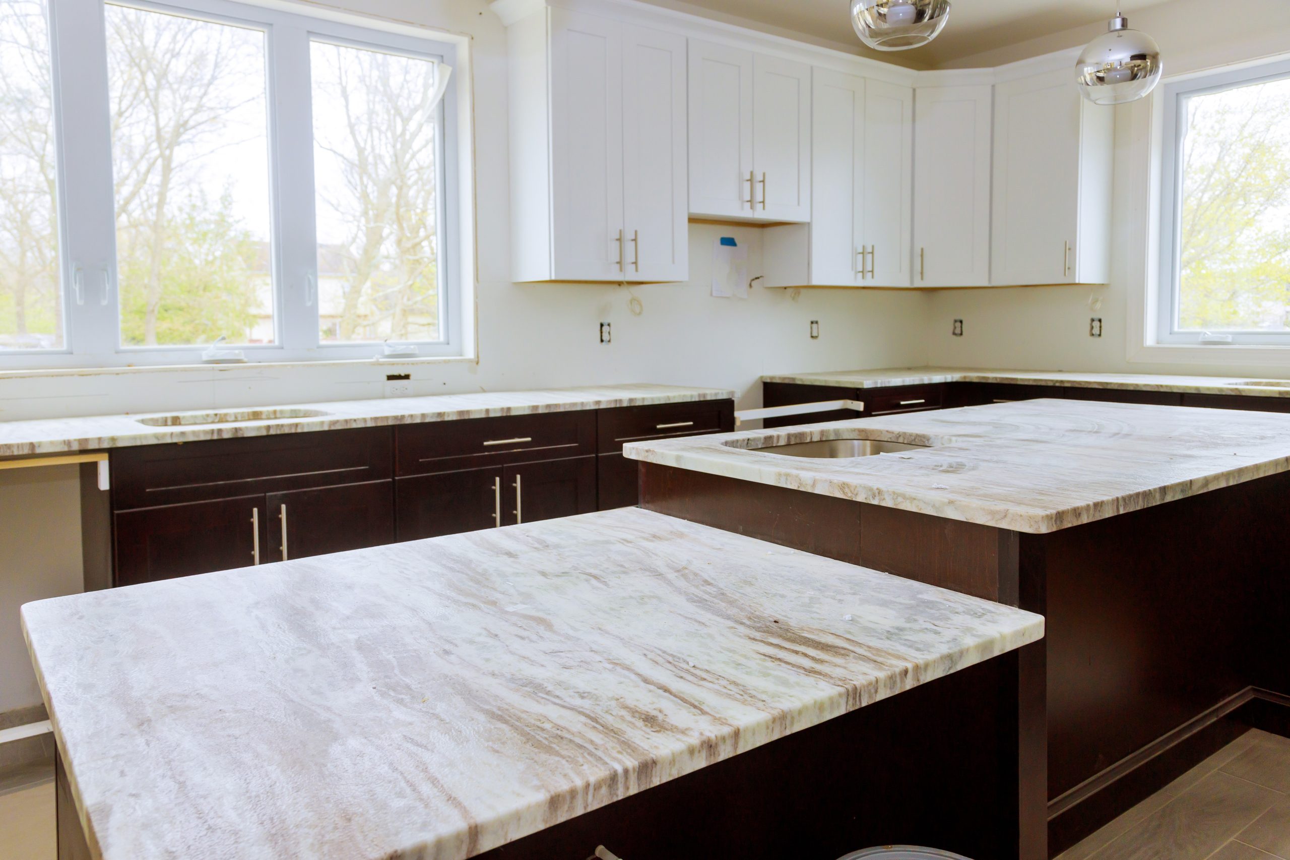 Home improvement and interior design new white kitchen renovation installing cabinets and counter top