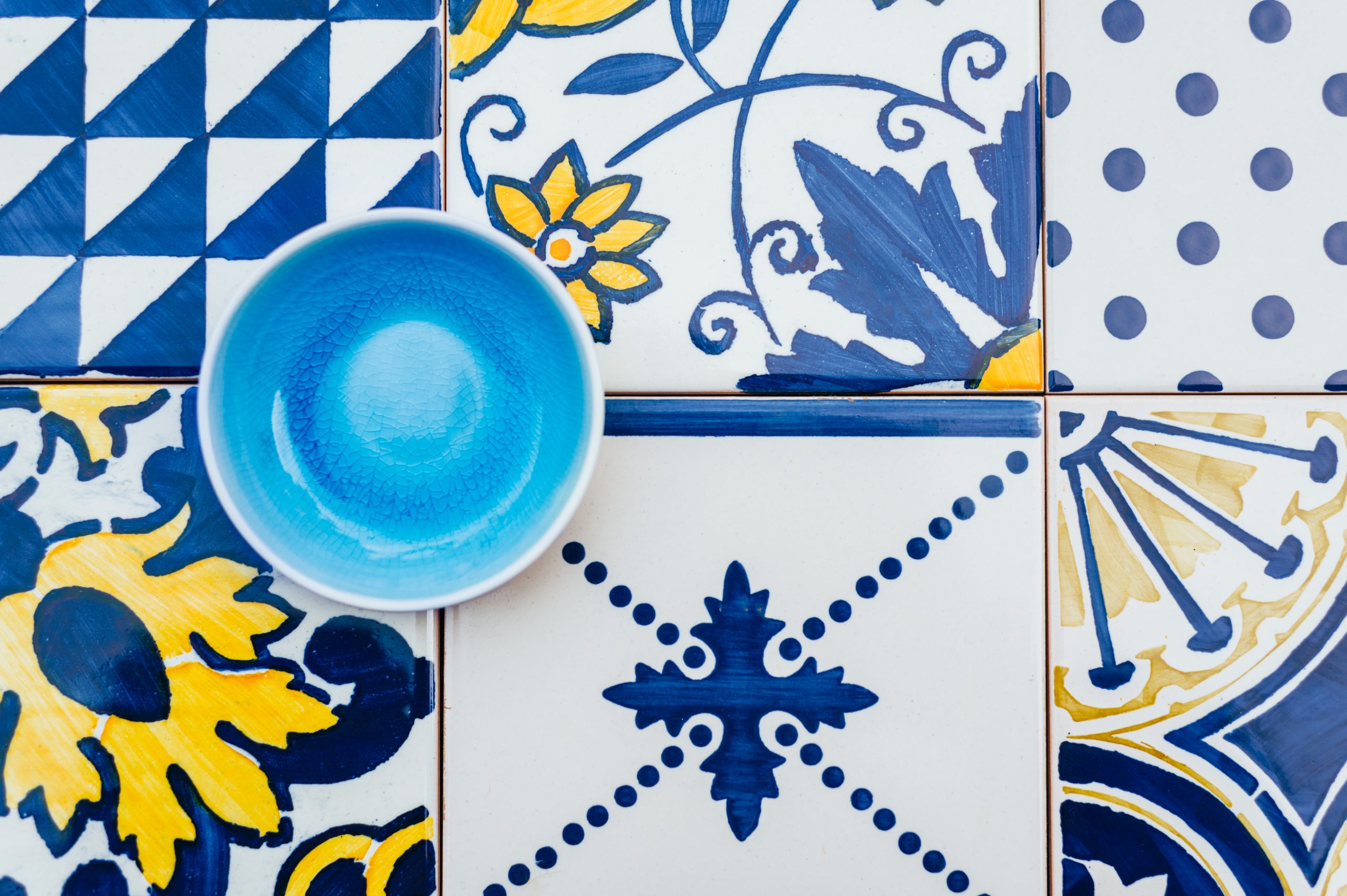 Ceramic Empty Blue Plate on Tile Background, Top View, Copy Space, Traditional Portuguese tiles Azulejo