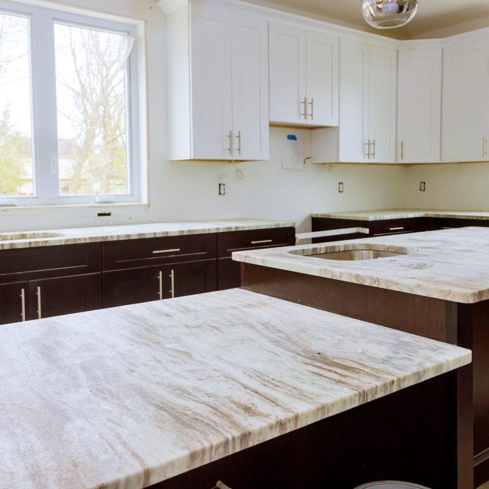 Home improvement and interior design new white kitchen renovation installing cabinets and counter top